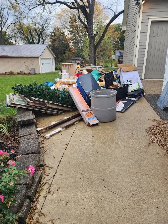 Dumpster being loaded with debris for Commercial Dumpster Rental in Sandwich